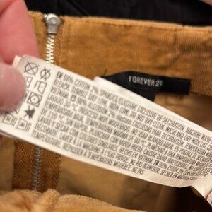 Forever 21 brand size M camel colored miniskirt with tie detail & zipper back